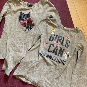 Two like new girls size mediums and small long sleeve tops from the Gap